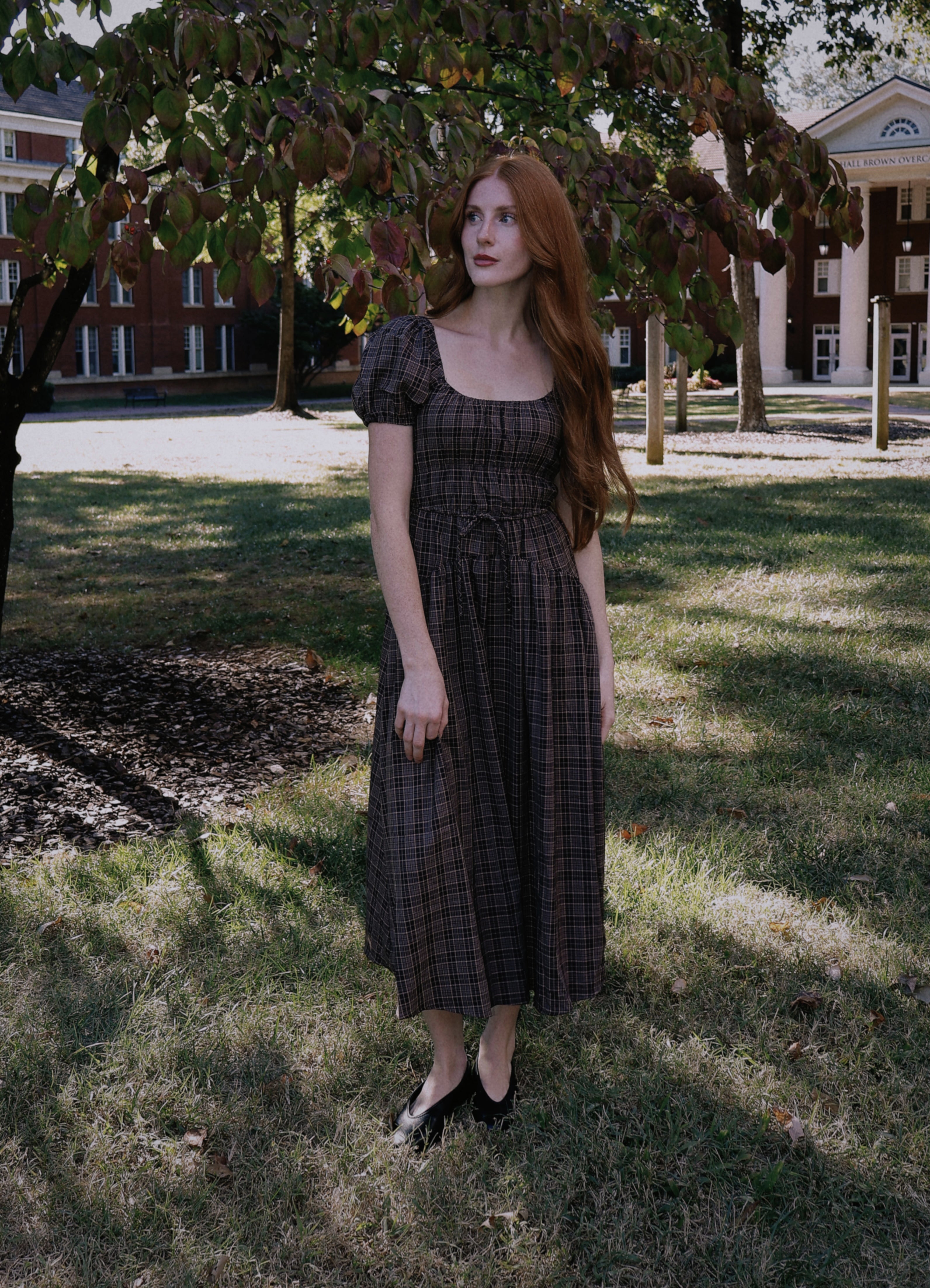Darla fall collection plaid dress photographed on a tree-lined campus